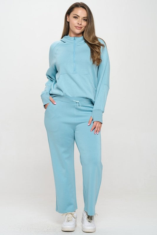 Light blue hooded quarter-zip hoodie with kangaroo pocket and long sleeves
