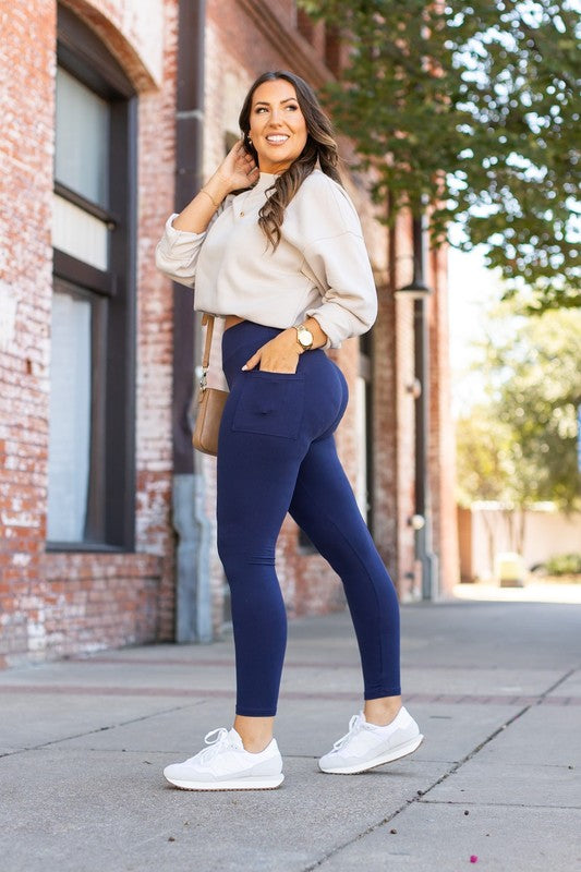 Navy full-length leggings with pockets, stretchy sculpted fit