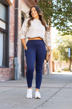 Navy full-length leggings with pockets, high-rise fitted waistband