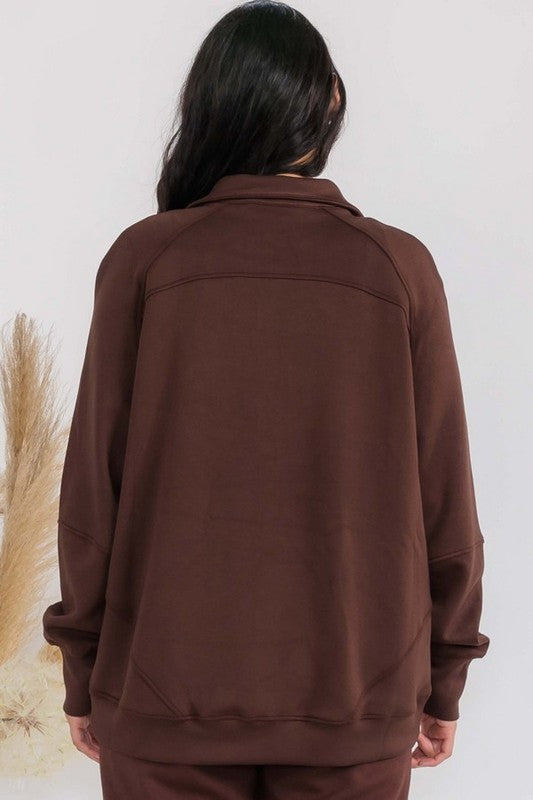 Maroon oversized zip-up jacket from the back with funnel neck and patch pockets