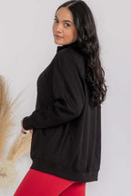 Black oversized funnel-neck zip-up jacket with raglan sleeves, side view