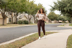 Brown crossover yoga leggings with fitted leg and side pockets