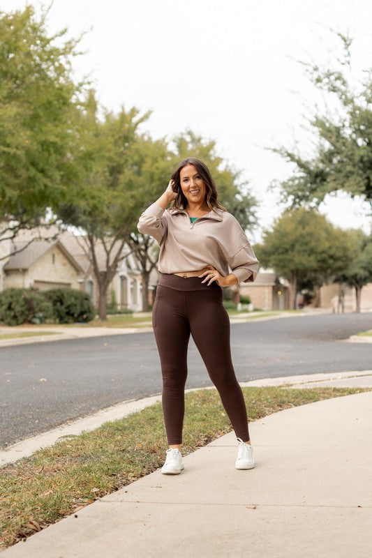 Brown crossover leggings with side pockets, full-length yoga fit