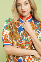 Paisley print v-neck blouse close-up with blue collar trim, multicolor