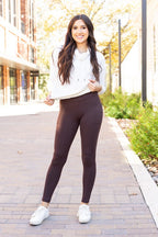 Brown crossover leggings with side pockets, full-length yoga pants