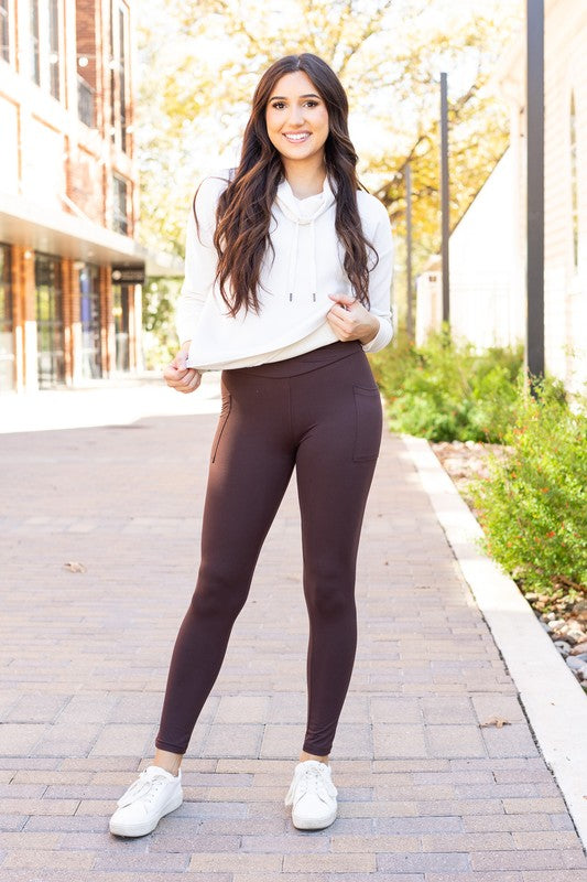 Brown crossover leggings with side pockets, full-length yoga pants