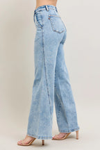 Plus size wide-leg jeans in light wash denim, back side view with belt loops