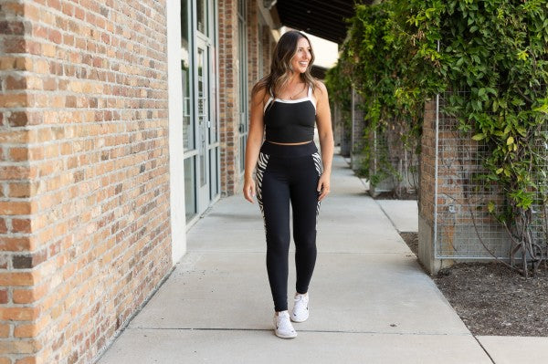 Black full-length leggings with zebra side panel and high-rise waist