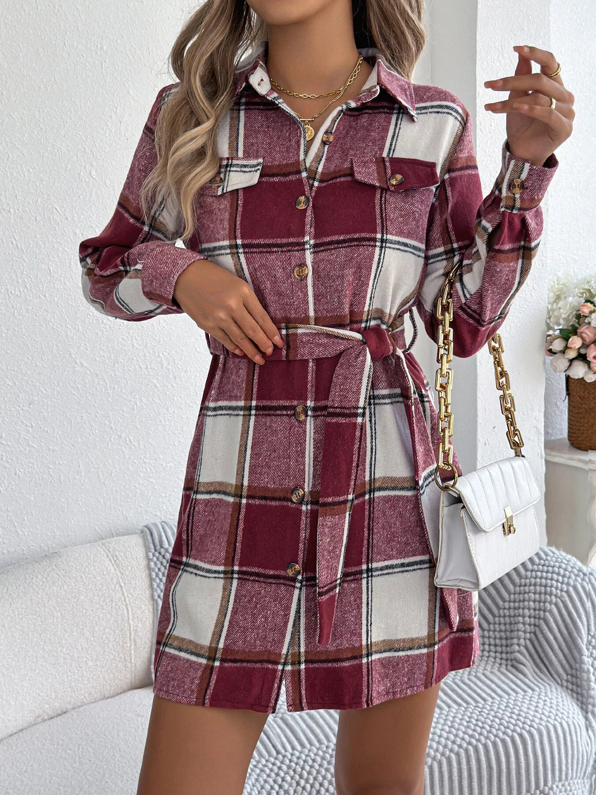 Burgundy plaid belted shirt dress with chest pockets, long sleeves, button front.