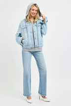 Oversized hooded light-wash denim jacket with drawstring hood and button front, full length