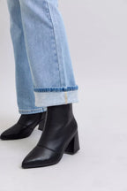 Judy Blue mid-rise thermal bootcut jeans with cuffed hem, worn with black ankle boots