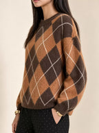 Fuzzy argyle knit sweater, brown with white diamond lattice, long sleeves, crew neck.