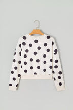 White kids’ sweatshirt back view with black polka dots; long sleeves and crew neck