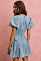 Light-wash denim mini dress with puff sleeves and gathered back yoke