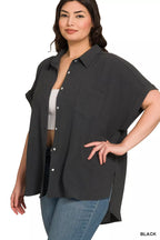 Black button-down blouse with short sleeves, chest pocket, and curved front