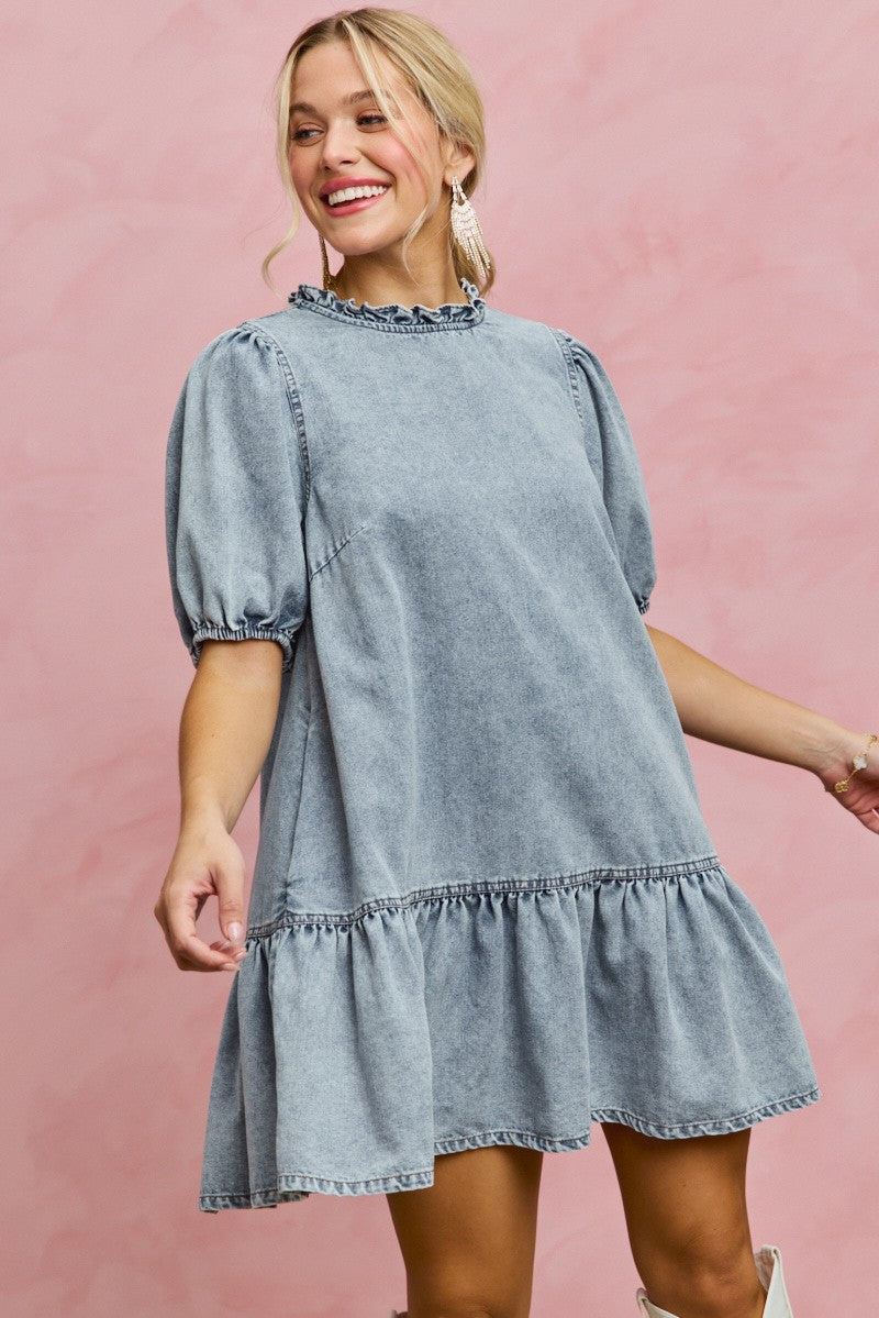 Light-wash denim mini dress with ruffled neckline, puff sleeves, gathered skirt hem