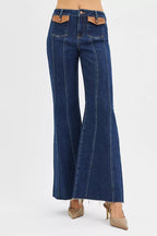 High-rise wide flare jeans with front leather pocket tabs, blue denim, long flare