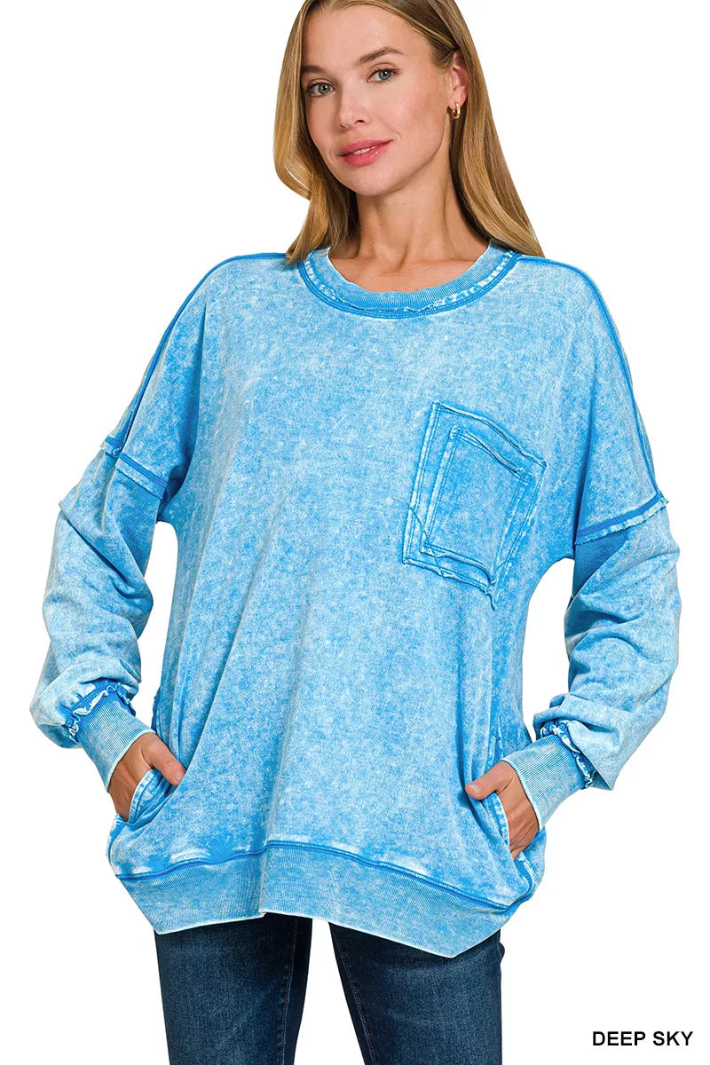 Women's blue acid-wash sweatshirt with crew neck, long sleeves, and front pocket