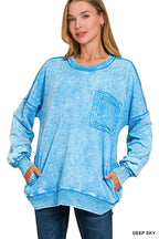 Women's blue acid-wash sweatshirt with crew neck, long sleeves, and front pocket