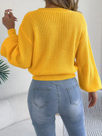 Back view of yellow argyle lantern-sleeve sweater with ribbed hem and cuffs