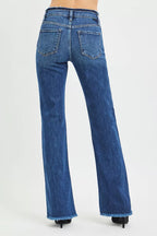 Women's mid-rise bootcut jeans in dark blue with back flap pockets