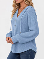 Light blue waffle-knit button hoodie with hood and long sleeves with ribbed cuffs.