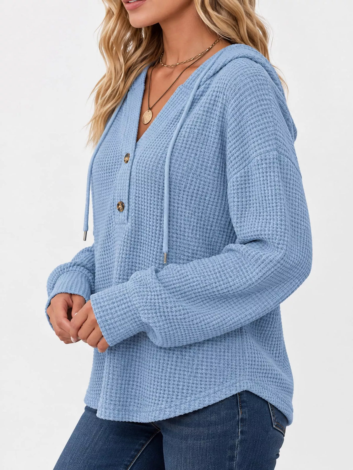 Light blue waffle-knit button hoodie with hood and long sleeves with ribbed cuffs.