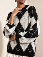 Fuzzy argyle knit sweater in black and cream with white diamond argyle and ribbed cuffs