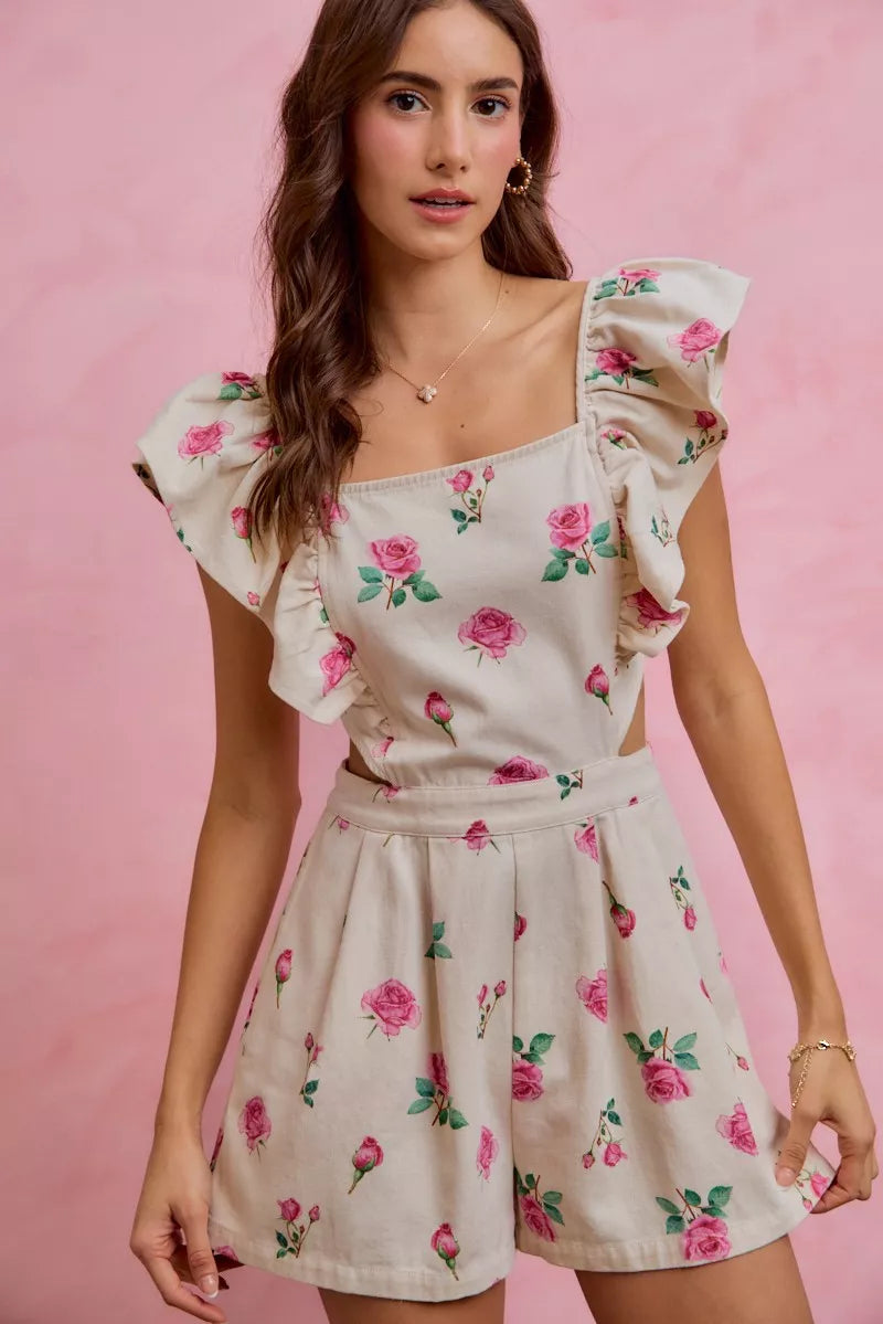 Ivory floral print denim romper with ruffled sleeves and gathered waist