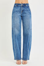 Medium-wash baggy jeans with button fly and relaxed straight legs, centered front