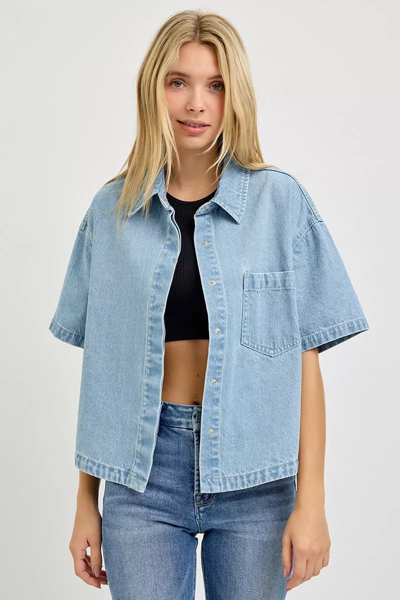 Light blue denim oversized cropped half-sleeve shirt worn open over black top