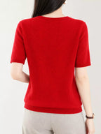 Bright red round-neck short-sleeve sweater, back view with ribbed hem