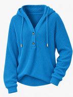 Bright blue waffle-knit button hoodie with hood, drawstring ties, and long sleeves.
