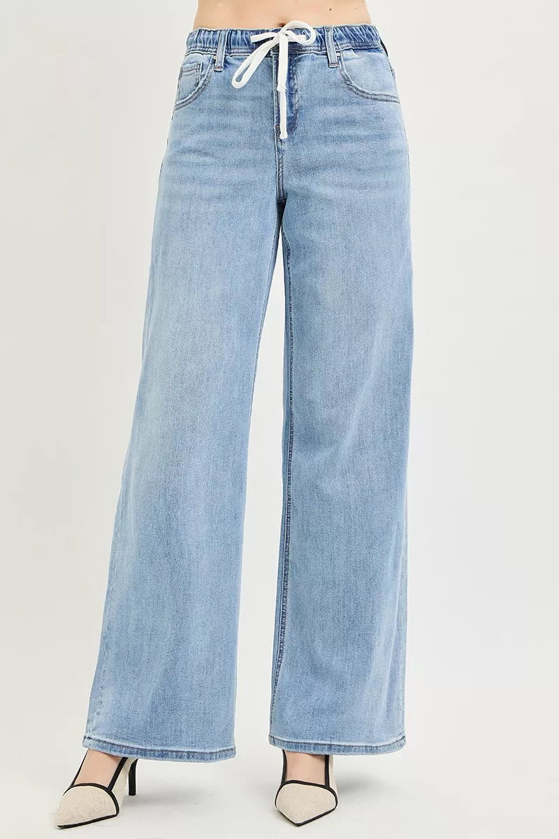 Light wash denim jeans, relaxed wide-leg fit with drawstring waist