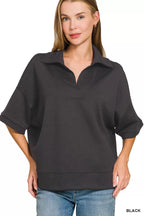 Black polo collar short-sleeve pullover sweater with buttonless placket and relaxed fit