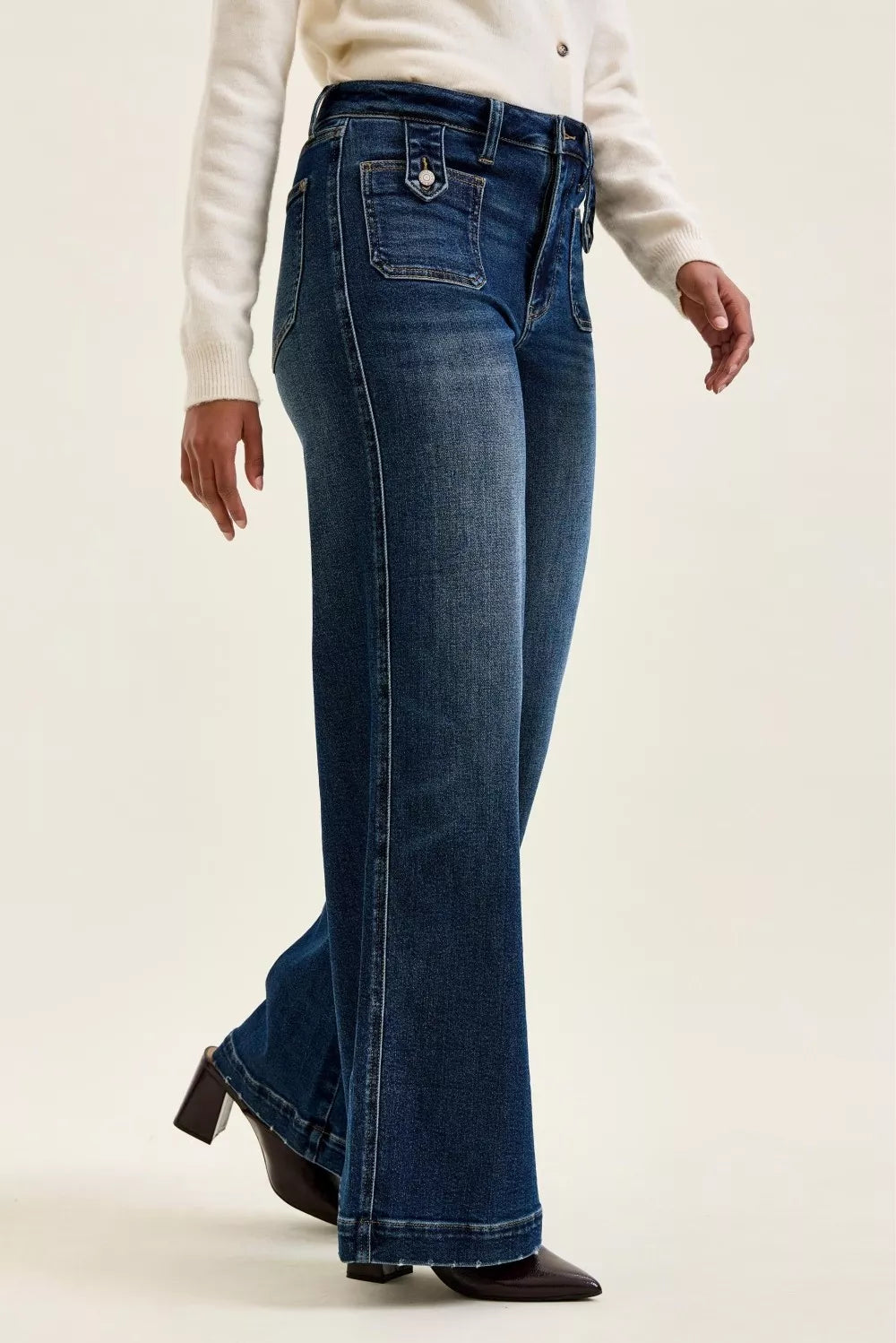 Dark indigo wide-leg jeans with stitched patch pockets and side seams