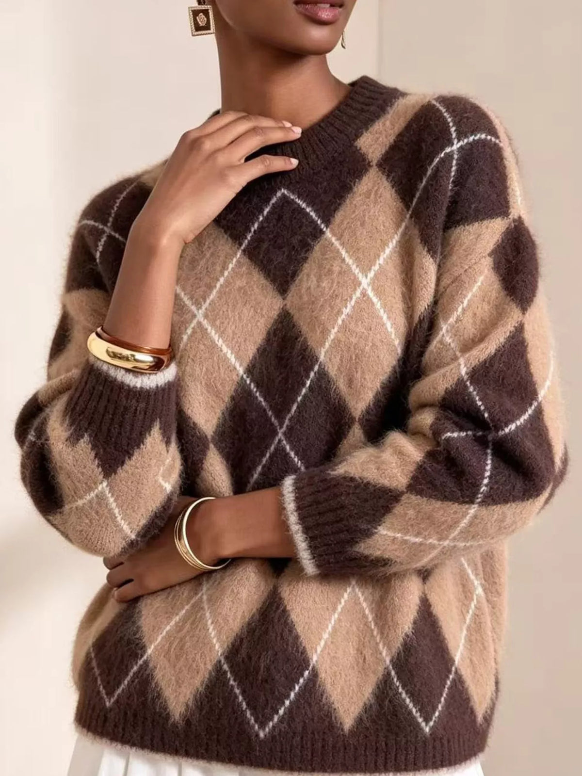 Fuzzy argyle knit sweater, brown and rust with white diamonds, long sleeves, crew neck.