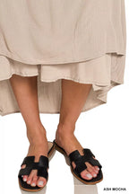 Ash mocha crinkle maxi dress with tiered ruffle hem and black slide sandals