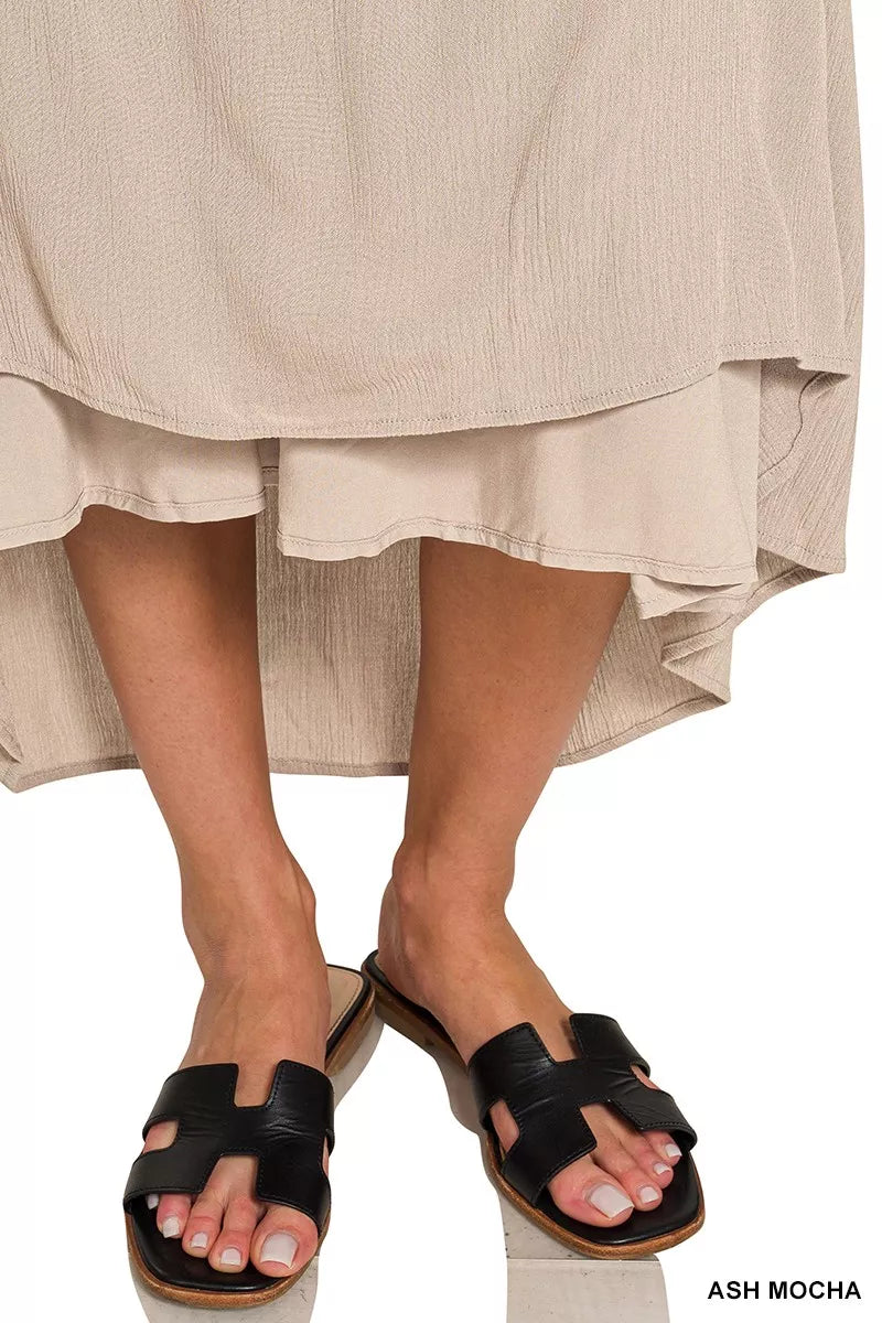Ash mocha crinkle maxi dress with tiered ruffle hem and black slide sandals