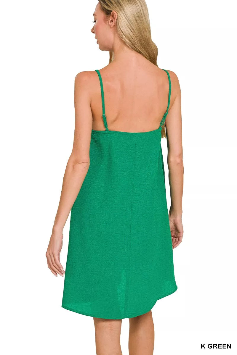Green woven mini dress with open square back and thin spaghetti straps