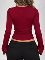 Red lace-trim V-neck long-sleeve tee, back view with ruched waist