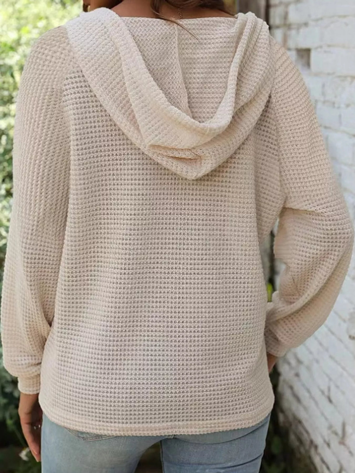 Back view of cream waffle-knit hooded button hoodie