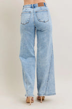 Plus size high-waist wide-leg jeans, light wash denim, back view with wide legs