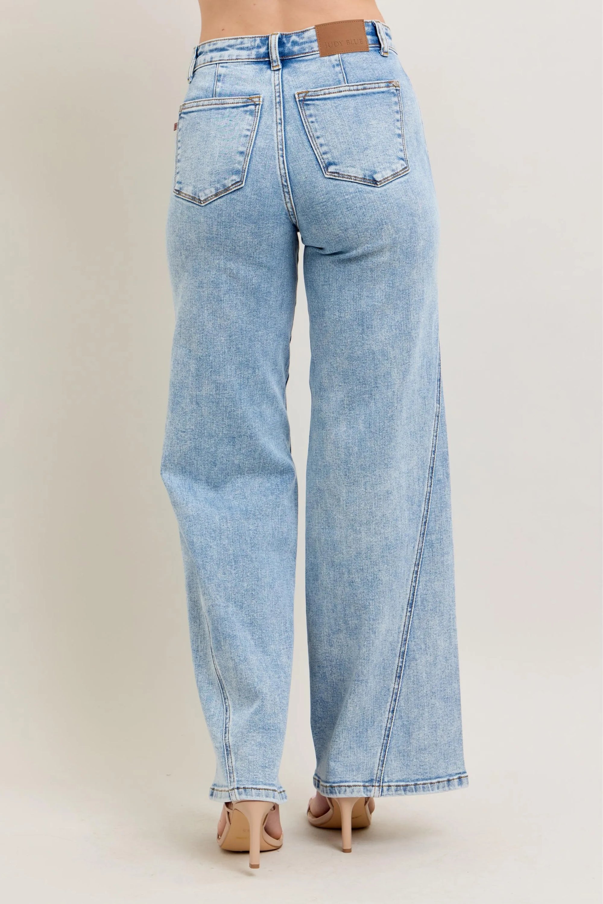 Plus size high-waist wide-leg jeans, light wash denim, back view with wide legs