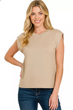 Women's light mocha sleeveless round-neck viscose sweater vest, hand on hip