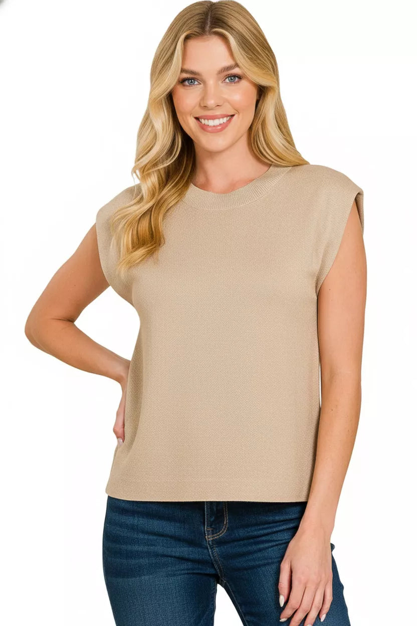 Women's light mocha sleeveless round-neck viscose sweater vest, hand on hip