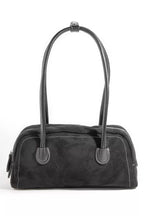 Black faux suede baguette hand bag with top handles and metal ring detail