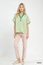 Green striped dolman top with embroidered puff sleeves and tassel V-neck