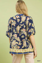 Navy floral boho rayon blouse back view with gathered shoulders and ruffled hem