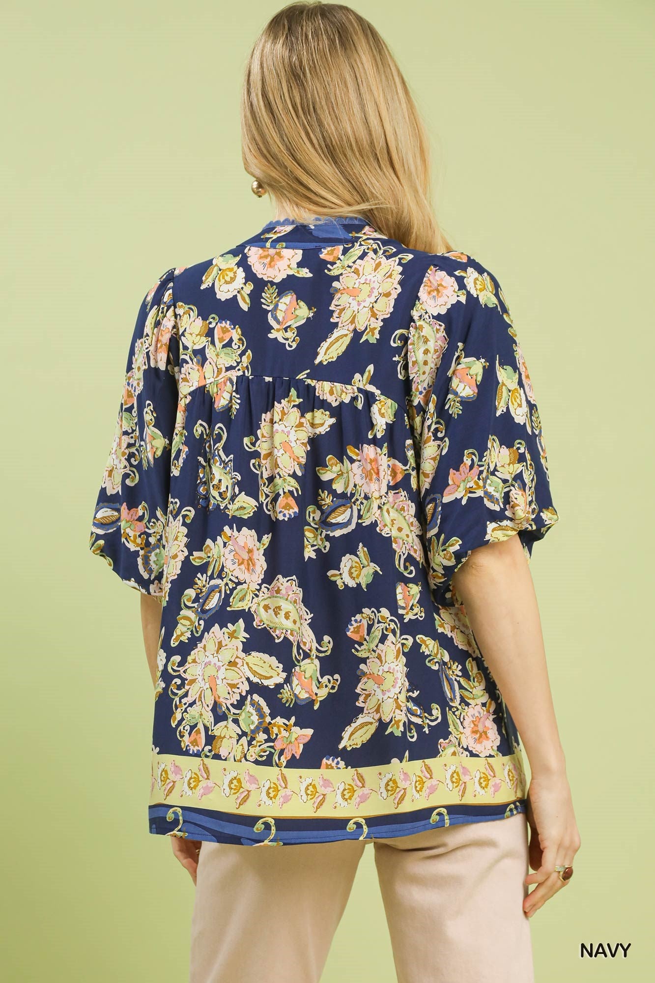 Navy floral boho rayon blouse back view with gathered shoulders and ruffled hem